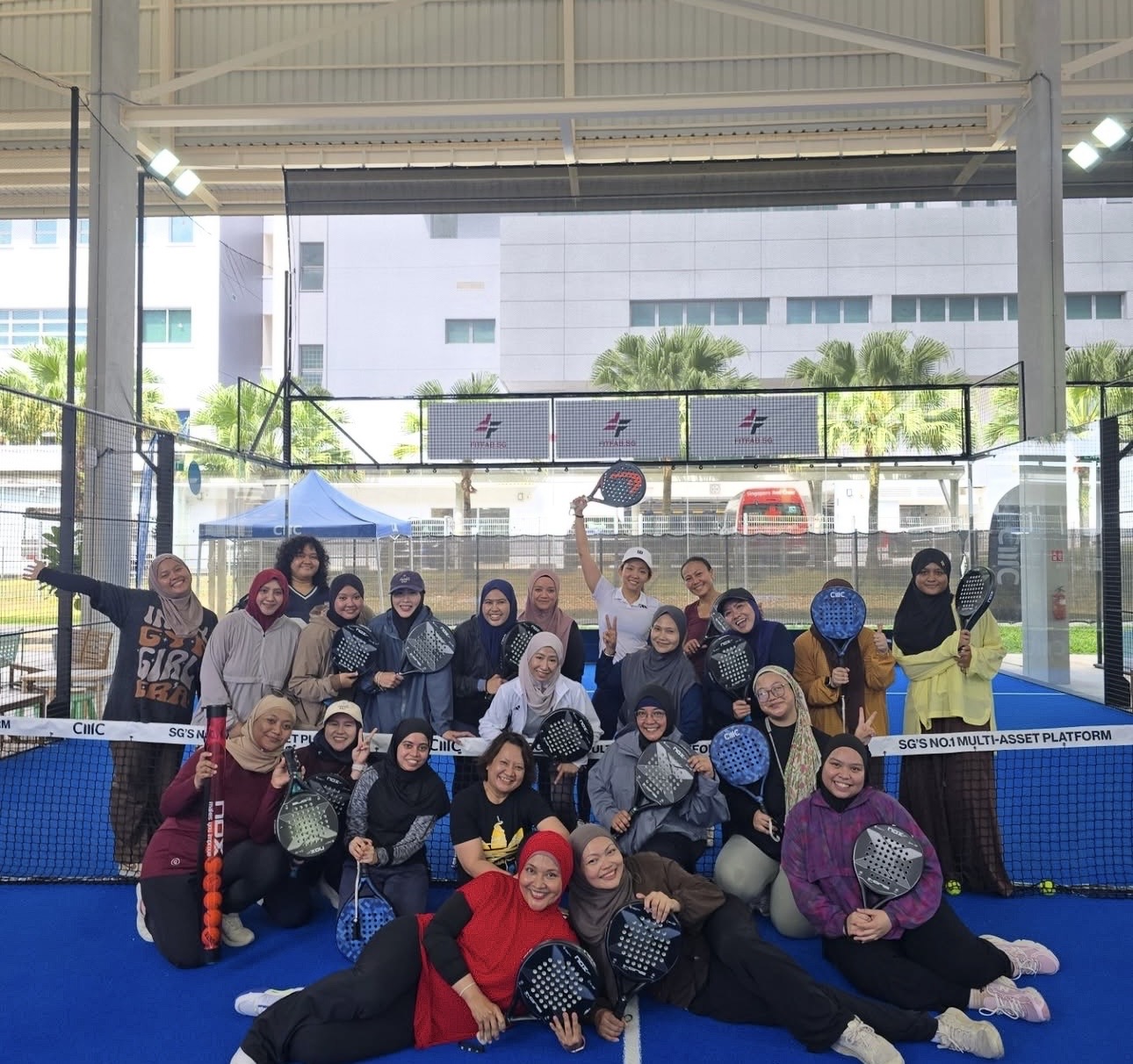 Women with padel rackets at a community padel day